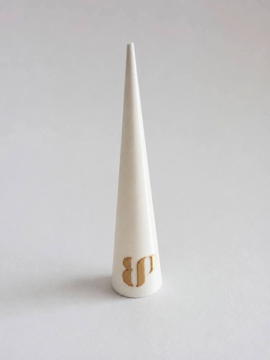 White ring display cone with gold BP monogram