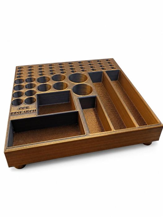 Walnut-and-brass colorway of the CGB Research vial organizer tray