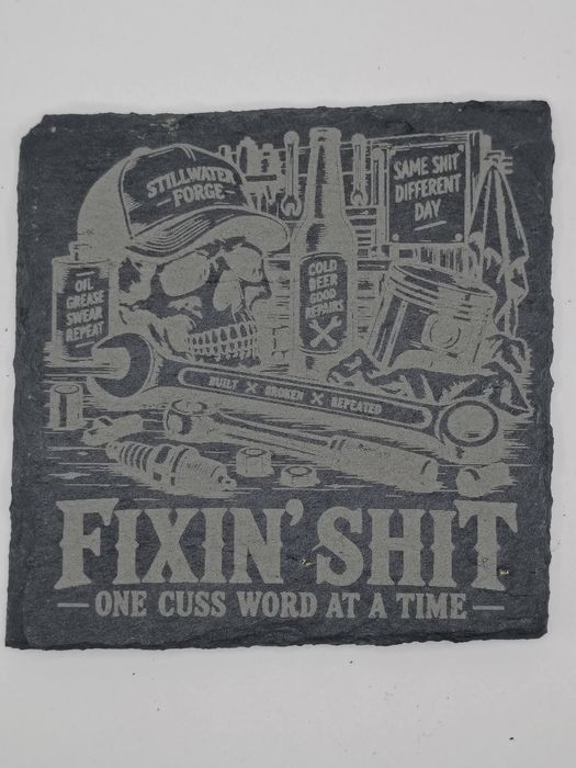 Square slate coaster: skull in a Stillwater Forge cap over a wrench and shop parts, titled Fixin&rsquo; Shit, One Cuss Word at a Time