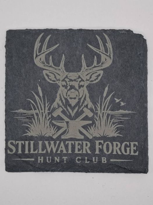 Slate coaster engraved with a whitetail buck over crossed hammers and an anvil, Stillwater Forge Hunt Club