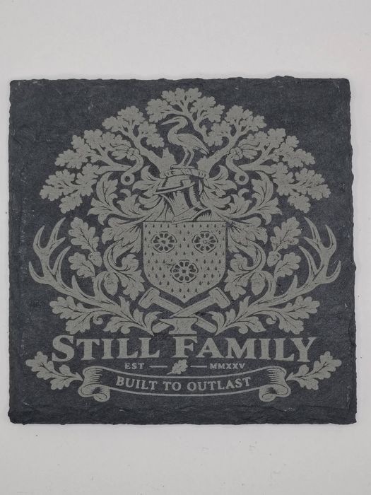 Slate coaster engraved with the Still family crest