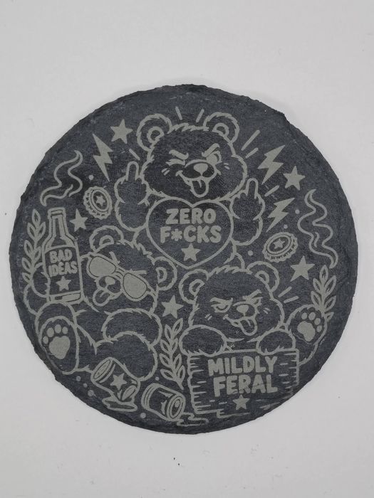Round slate coaster: cartoon bears with a Zero F*cks heart and a Mildly Feral sign